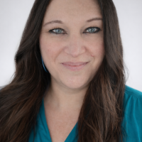 Debbie Rosko, a white woman with long brown hair